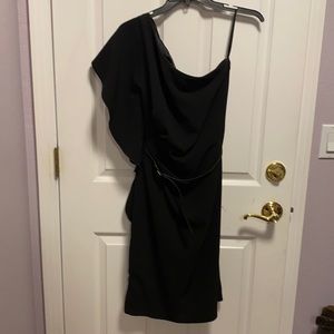 One shoulder black dress.